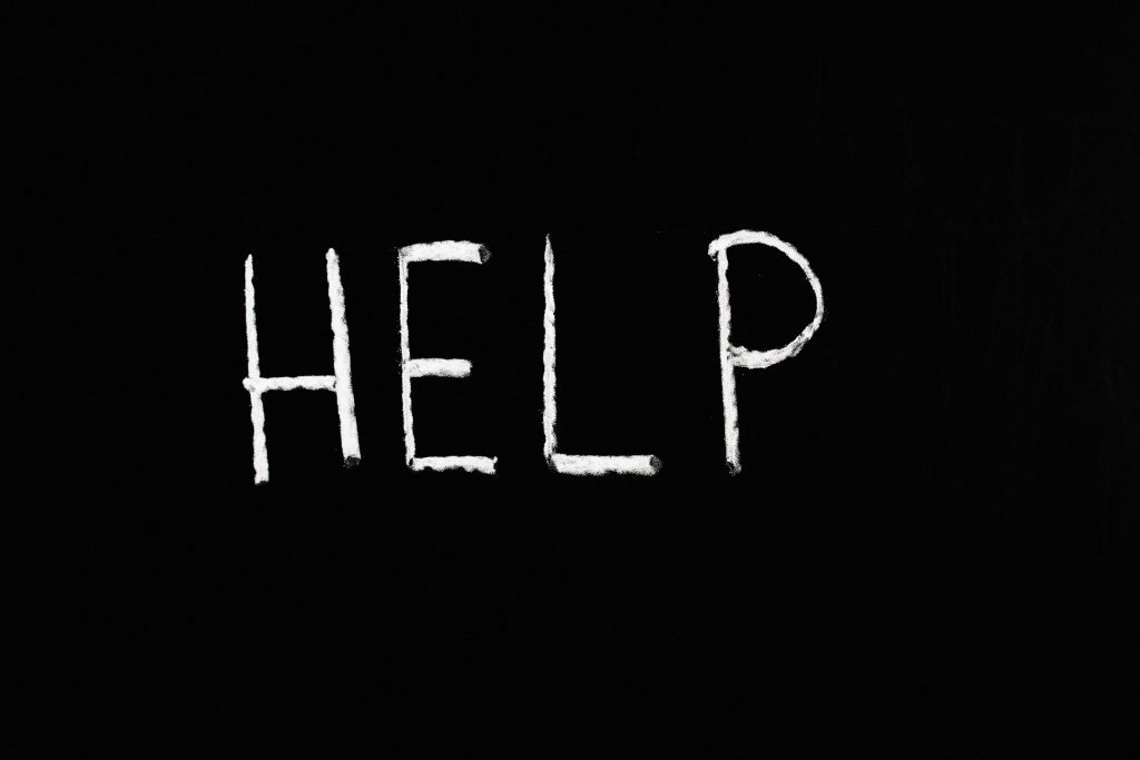 pexels-photo-5697250-5697250 Chalk-written 'HELP' on a deep black background symbolizes assistance and encouragement.